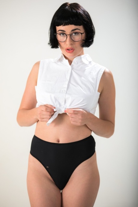 Dark haired chick Olive Glass removes glasses before standing naked 96859213