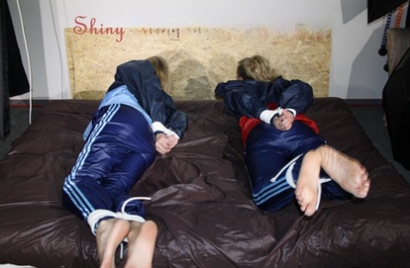 Blonde chicks are left gagged and tied up in nylon clothing 28797322