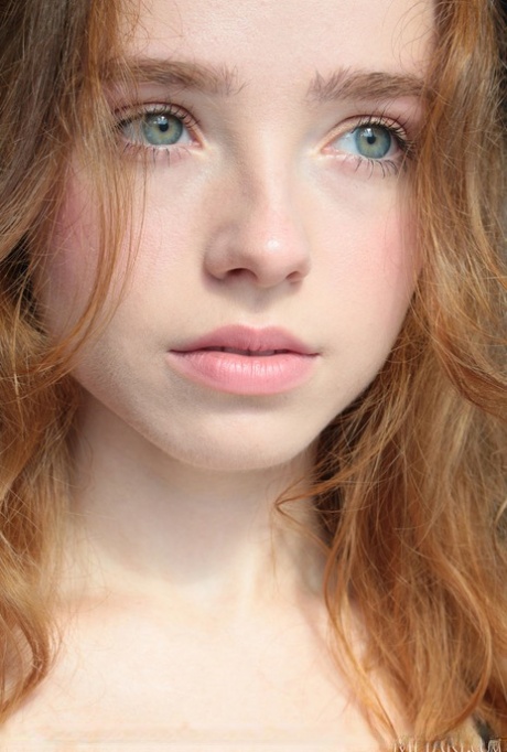 Young redhead Rinna Ly slips off black lingerie in a tempting fashion 49888001
